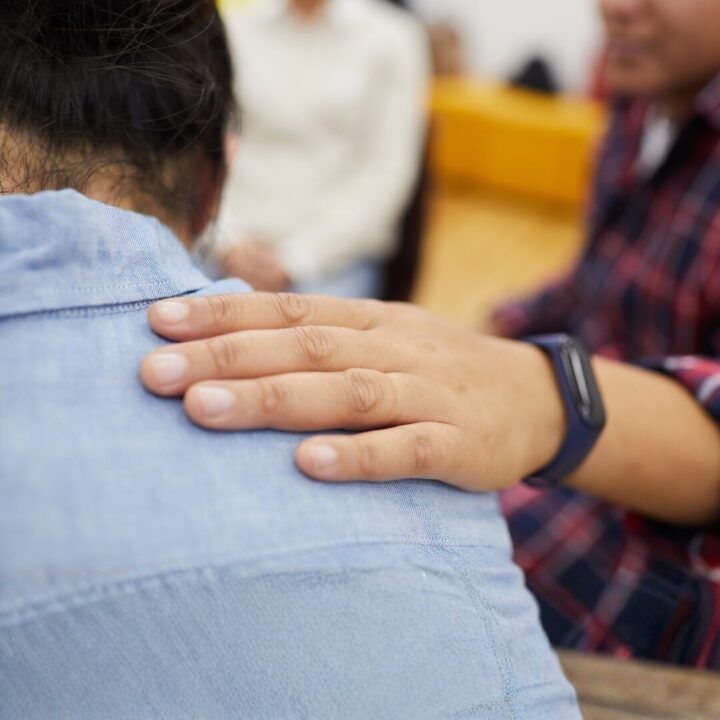 Hand on shoulder